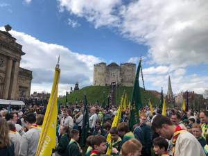 Scout groups gathering at the eye of york with castle in the background